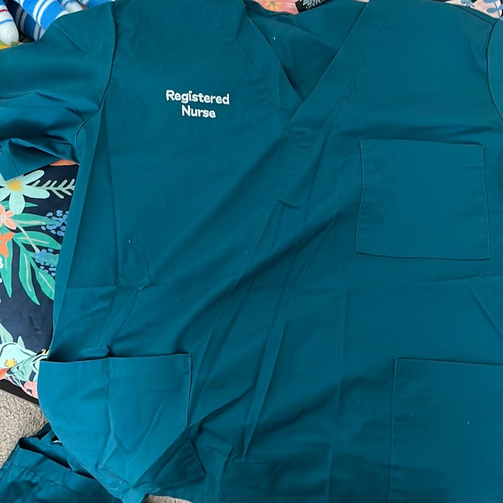 Carribean blue embroidered scrub shirts.